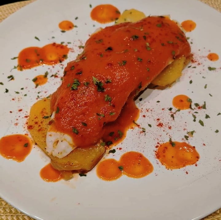 Baked Hake with Potatoes and Tomato Sauce